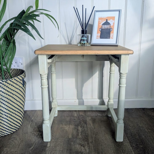 light green nest of tables with wood top