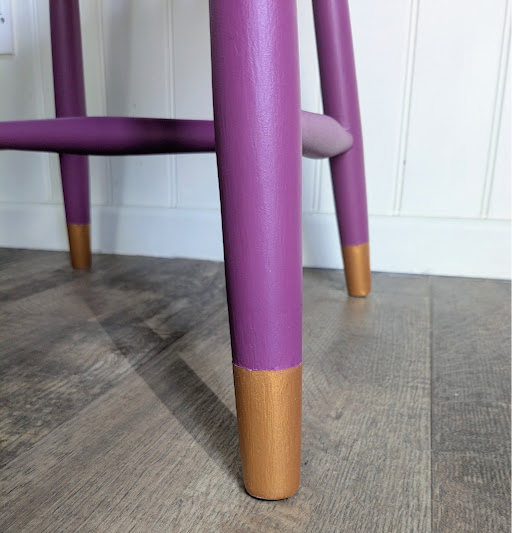 Purple and gold dining chair close up of legs
