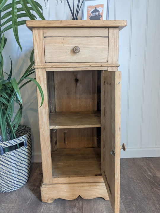 narrow wooden cupboard