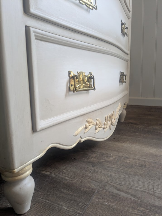 chest of drawers with gold detail