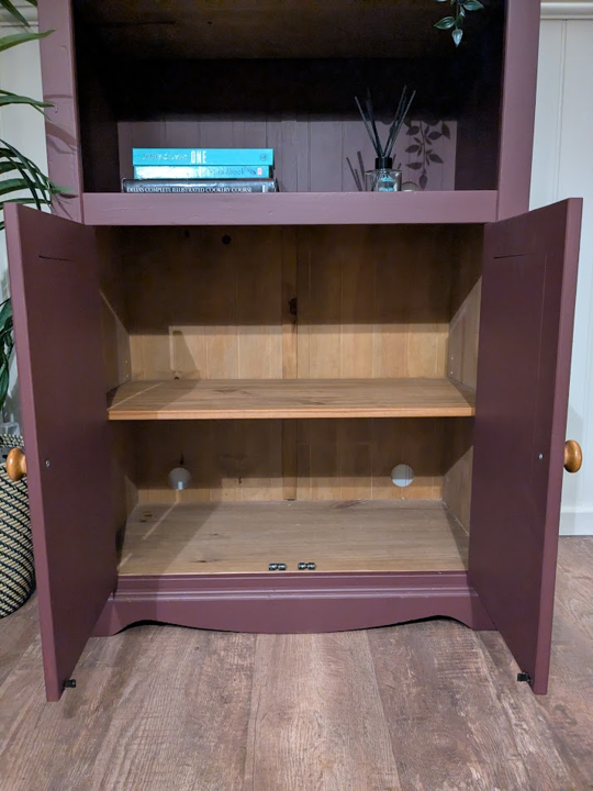 Purple bookcase with storage cupboard