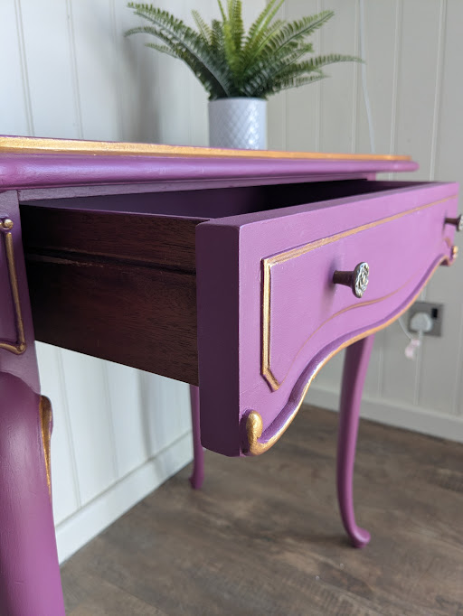 Unique purple and gold painted hallway table