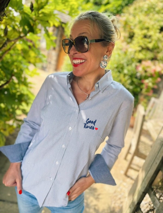 Woman wearing navy stripe Good Times shirt