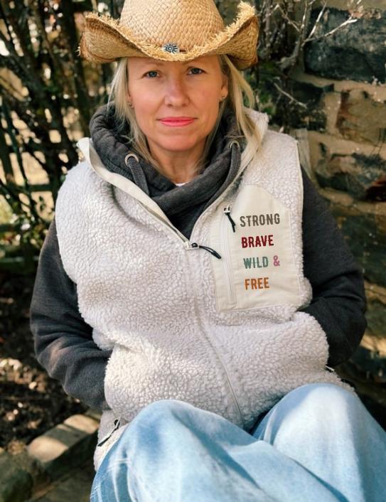 Woman wearing unisex Sherpa Gilet in stone