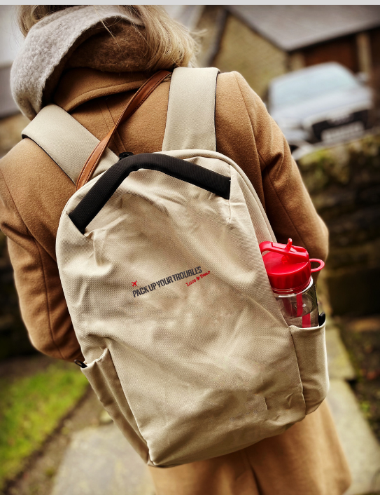 Woman wearing Pack up your Troubles Backpack