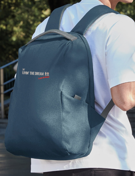 Man wearing Livin’ the Dream Backpack in Slate Blue