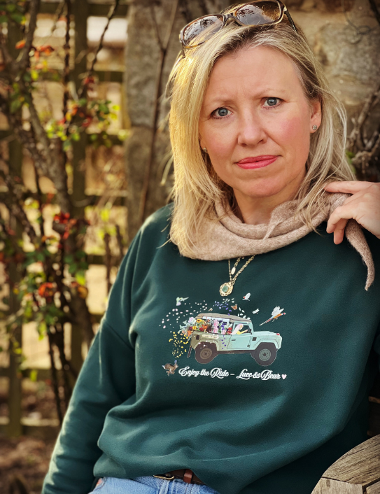 Woman wearing Forest green Enjoy the Ride Sweatshirt