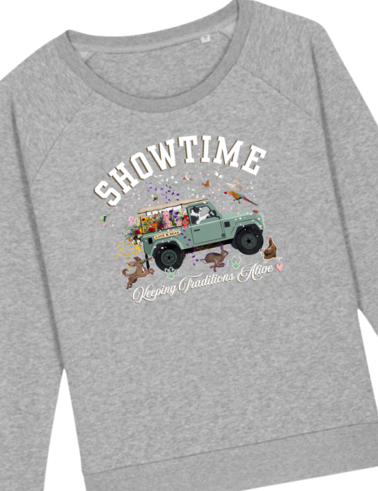 Woman wearing grey Showtime Sweatshirt , neck scarf and Zac cap