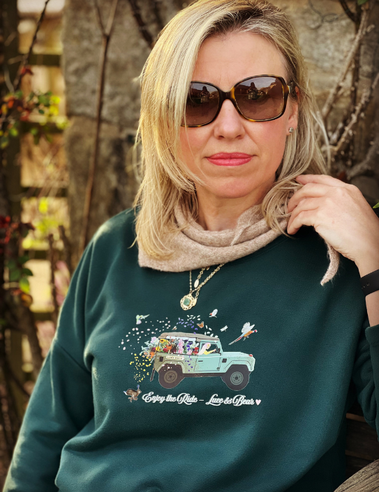 Woman wearing Forest green Enjoy the Ride Sweatshirt