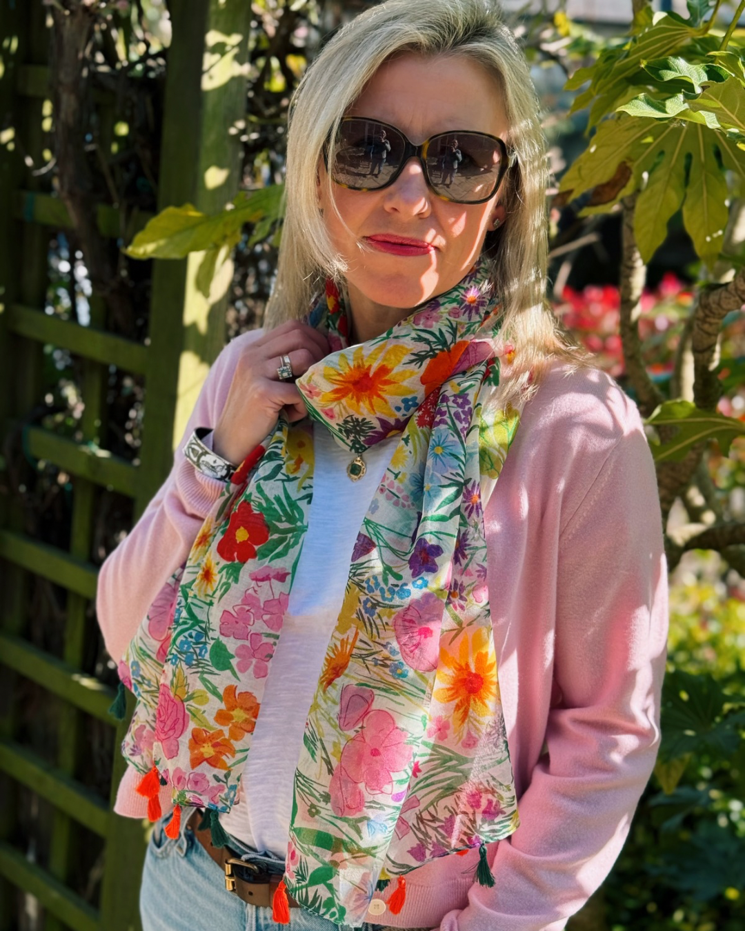 Close up of woman wearing Bloomin Lovely Flower Scarf