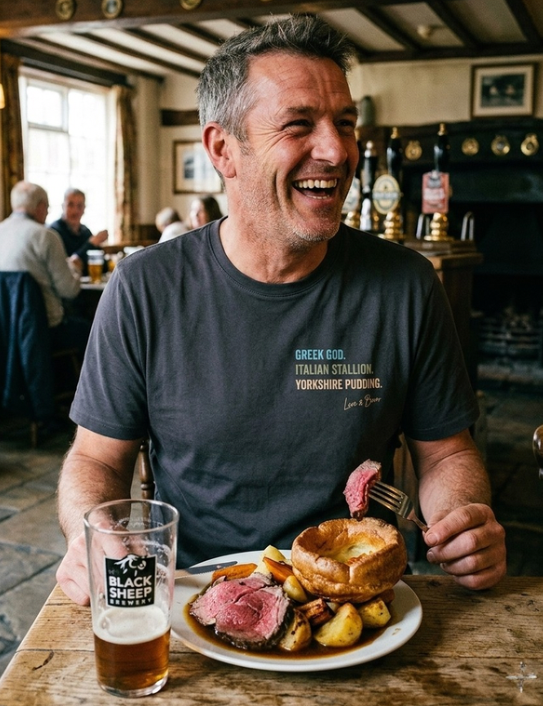 Man wearing charcoal Yorkshire Pudding T-shirt eating Sunday dinner
