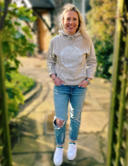 Woman wearing Unisex Healing Hoodie in stone