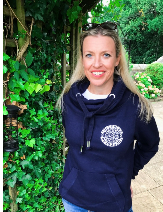 Woman wearing navy unisex Power cross neck hoodie