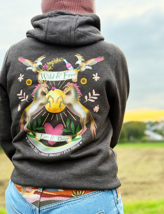 Woman wearing Wild and Free Zip Hoodie in vintage charcoal