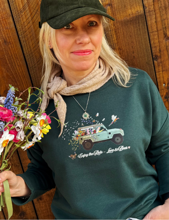 Woman wearing Forest green Enjoy the Ride Sweatshirt