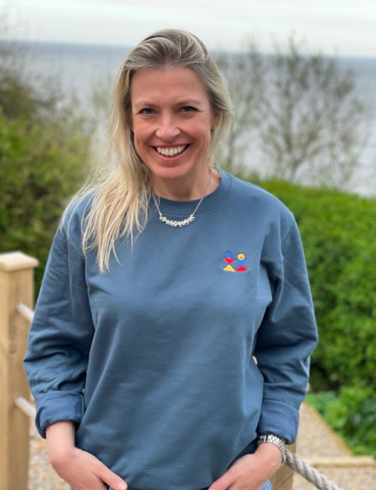 Woman wearing ocean embroidered logo sweat