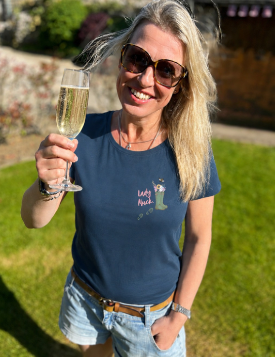 Woman wearing denim blue Lady Muck Tee