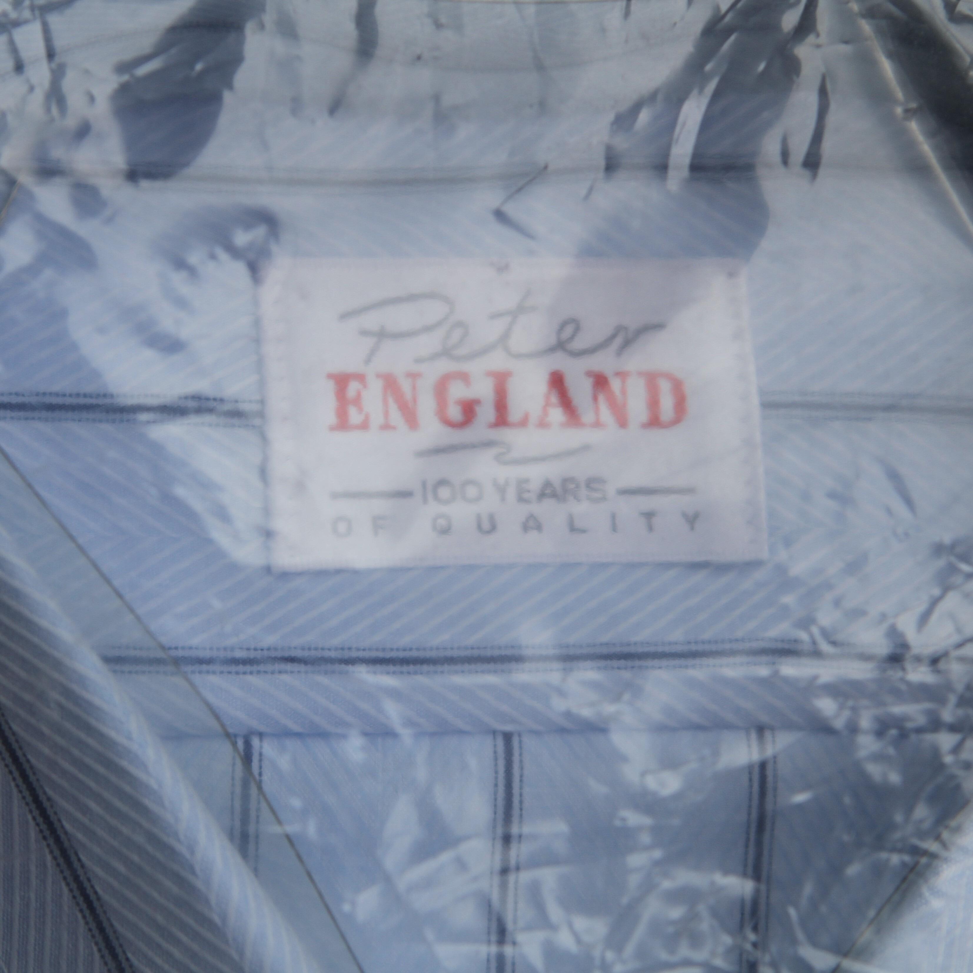 vintage 1980s unworn shirt, in blue with a black vertical stripe- label