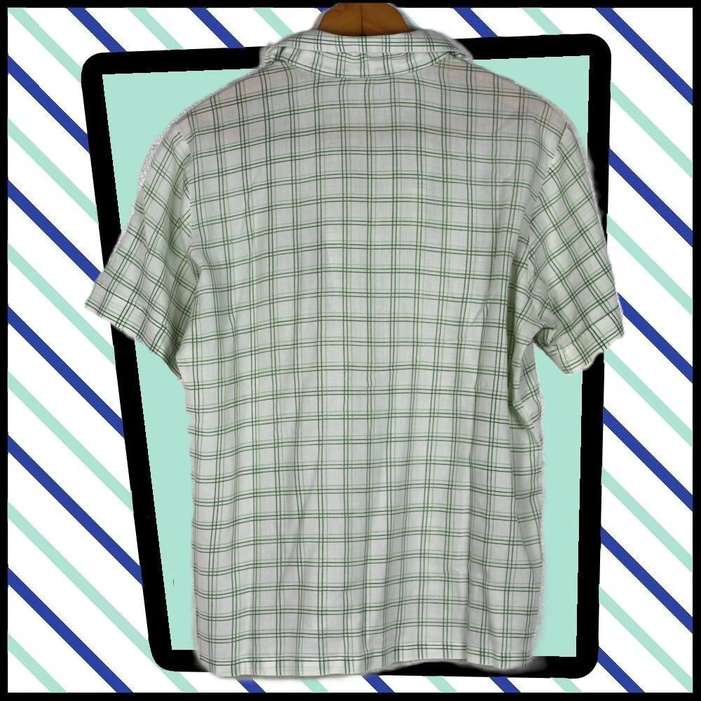 A cool shirt in green checks on a pale green background- rear view