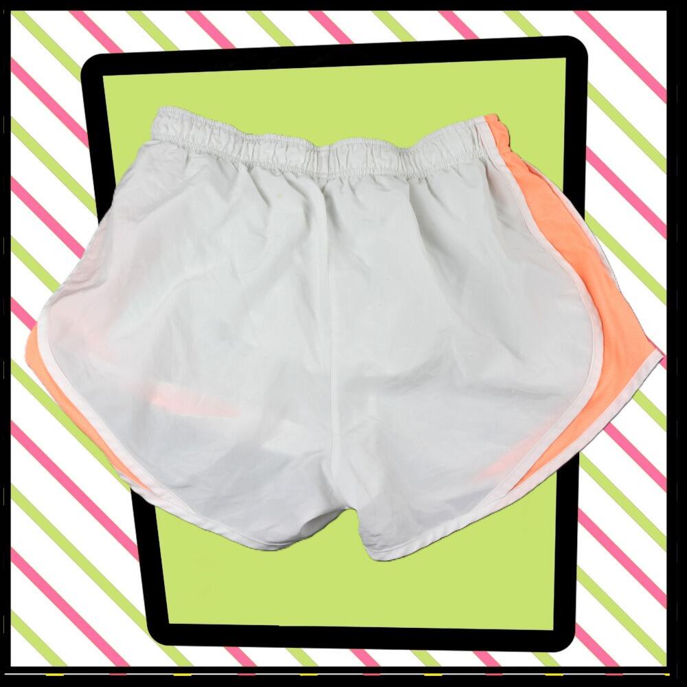 Nike lightweight sports shorts, in white with peach trim- rear view