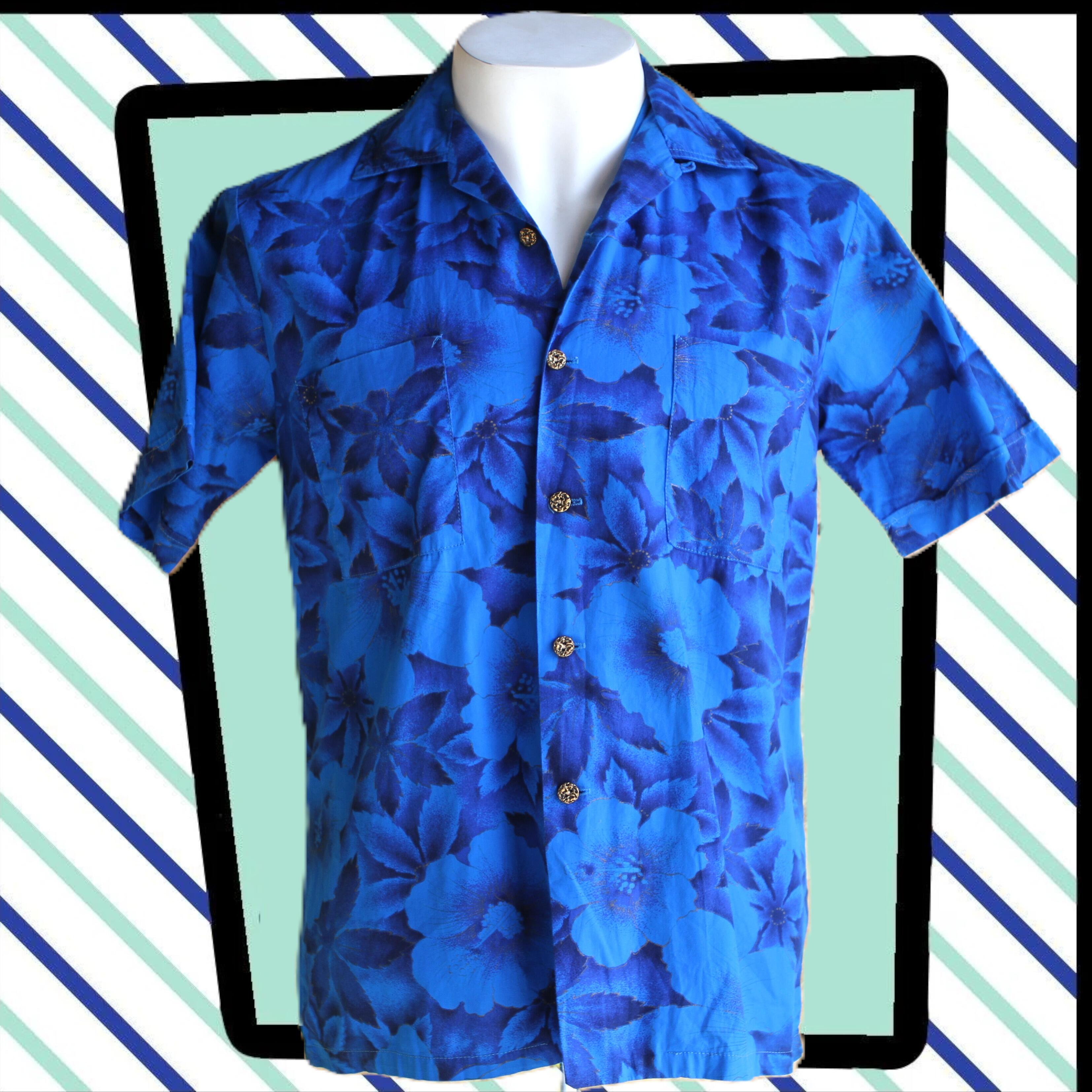 amazing original vintage 60s Waikiki Wear Hawaiian shirt in blue with a floral design in blues black and gold- very cool