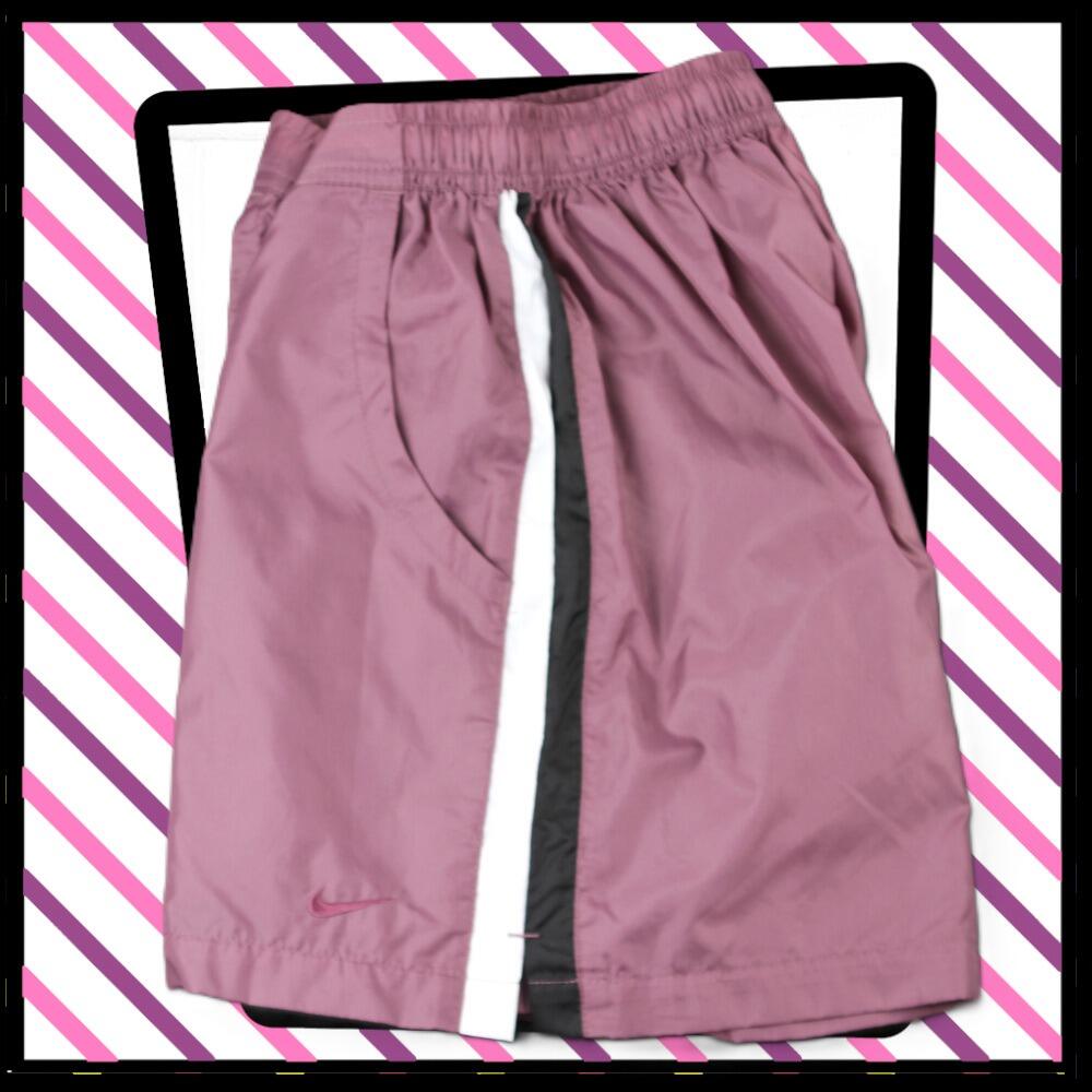 Nike lightweight sports shorts, in mauve with white and black vertical stripes at the side