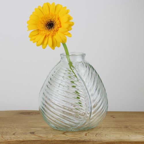 Small clear glass bud vase with yellow flower