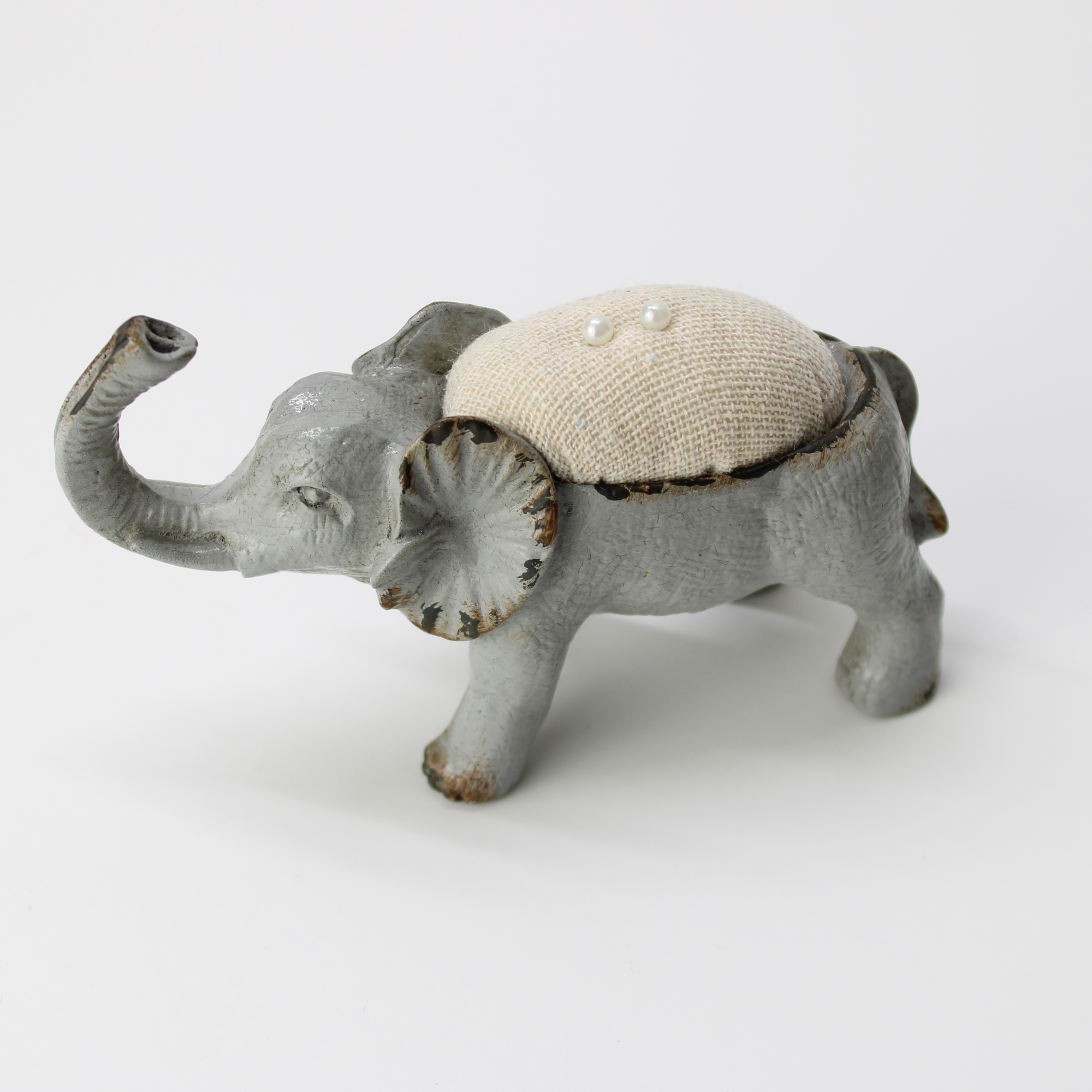 Collectible elephant pincushion with fabric cushion back