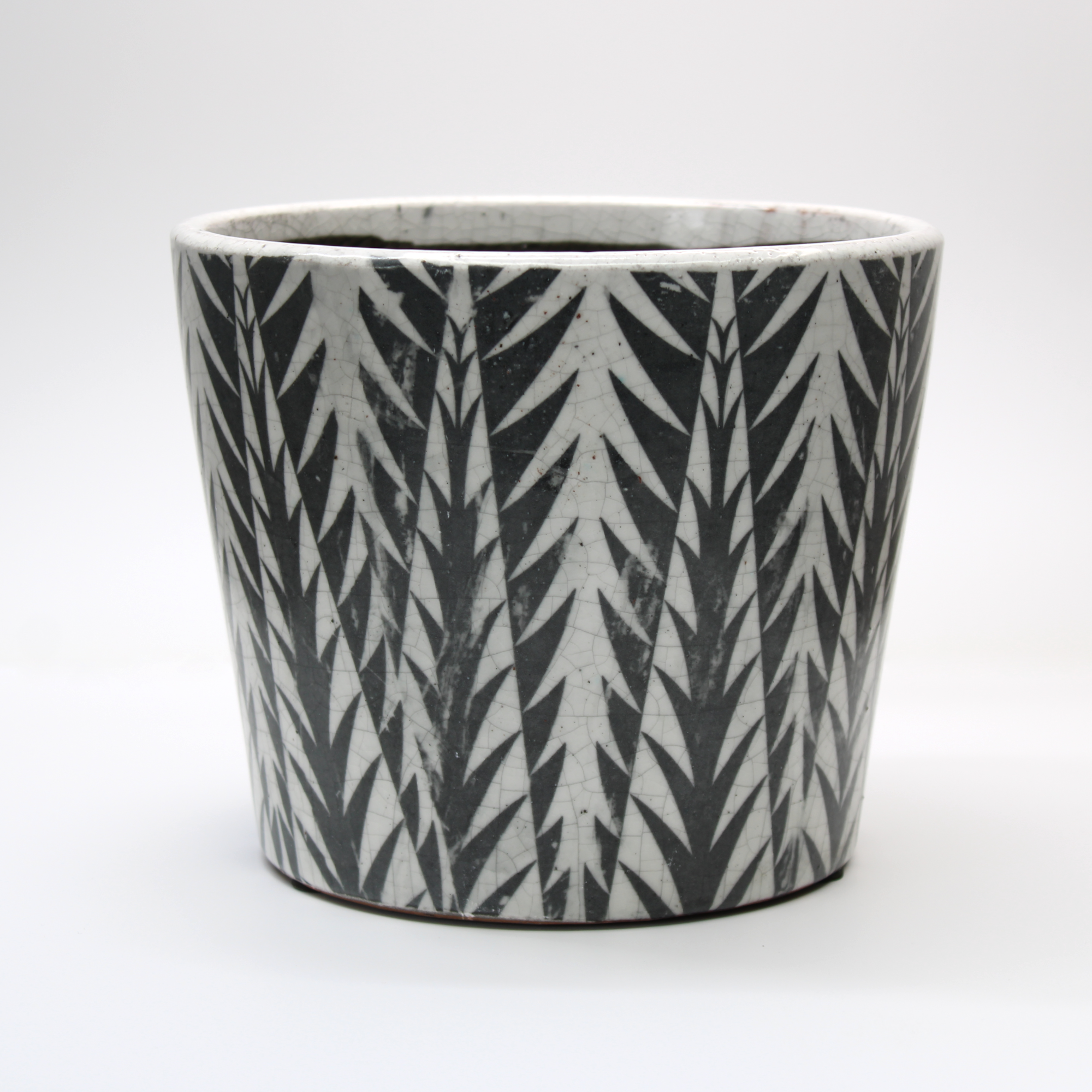 vintage glazed plant pot with a black and white design