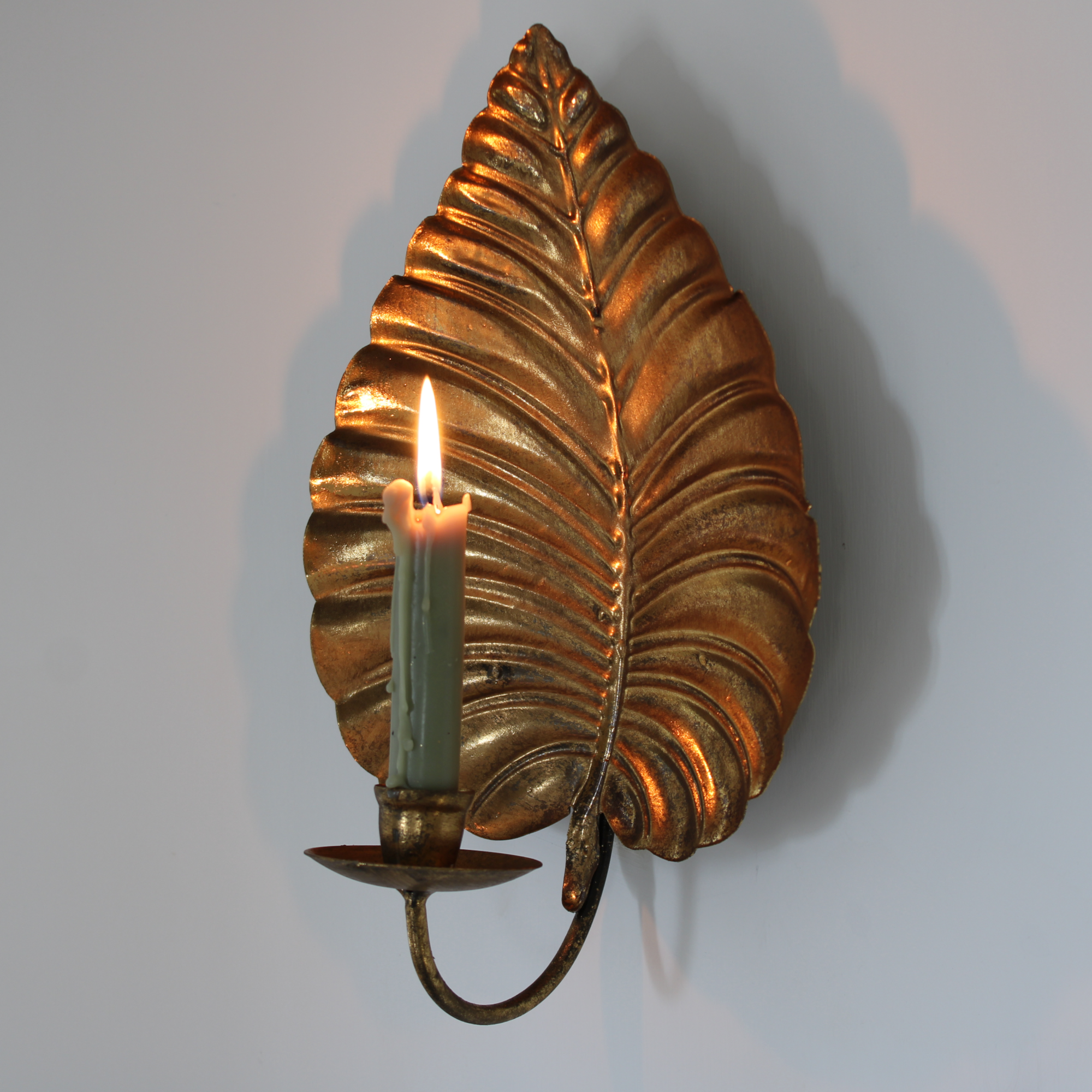 Luxury gold candle wall sconce.