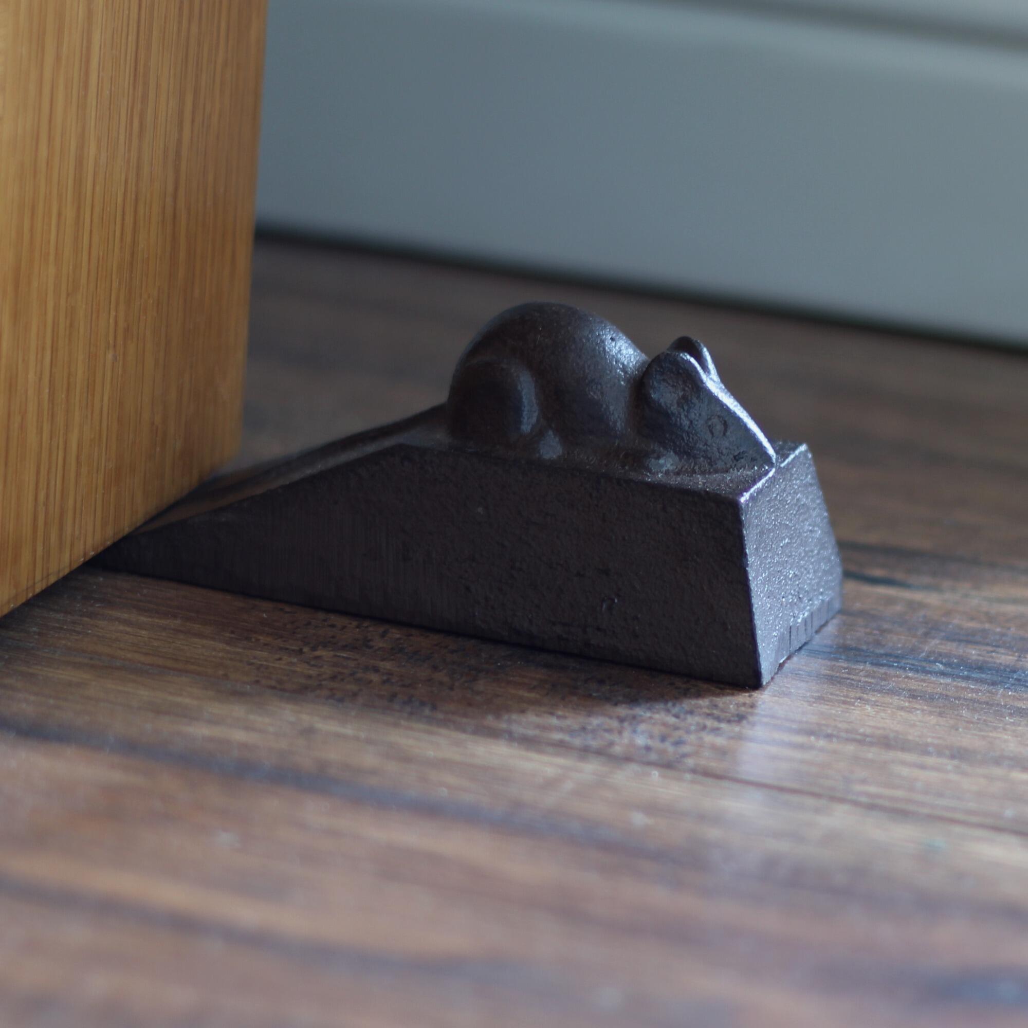 Door wedge cast iron.