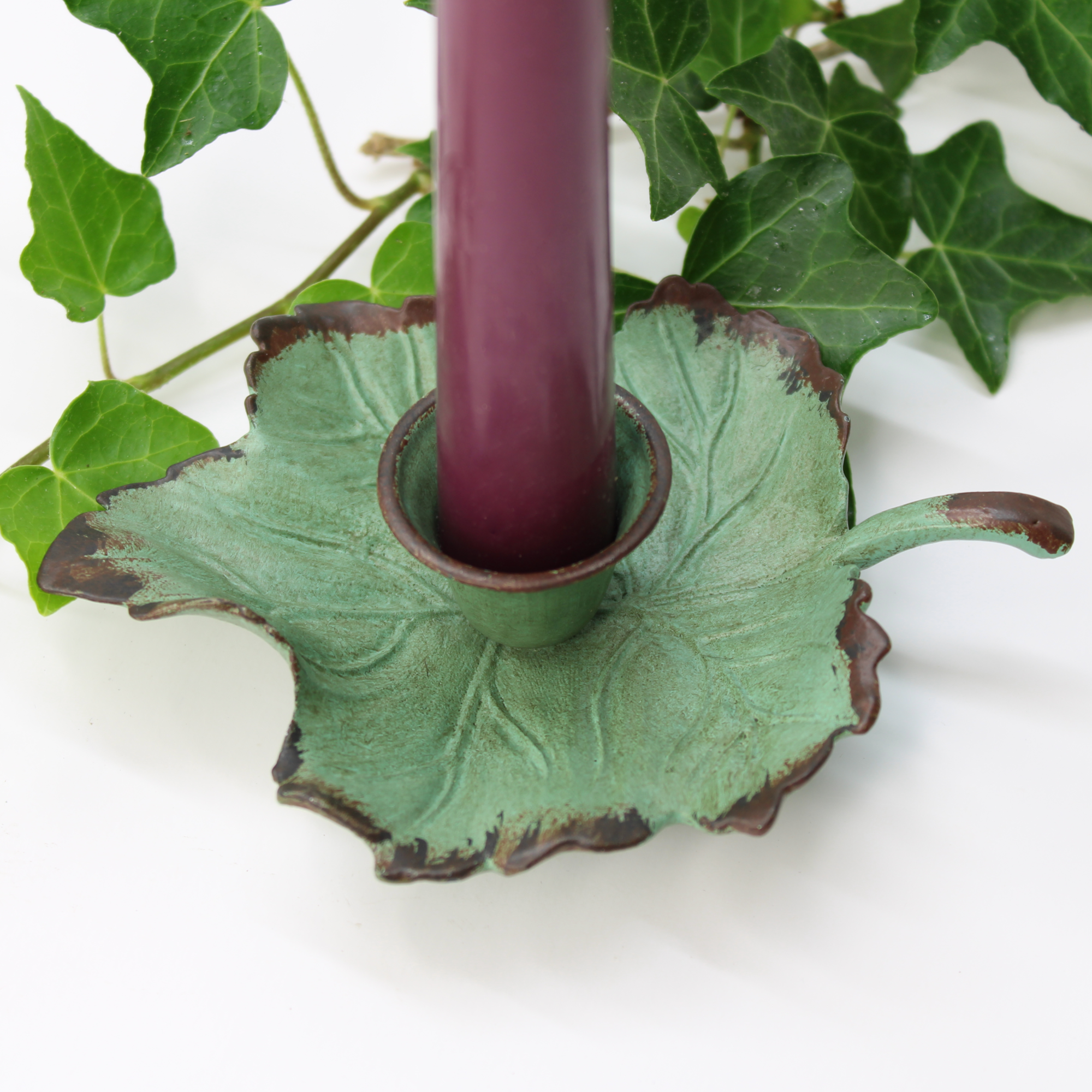 handcrafted rustic taper candle holder with garden-inspired design