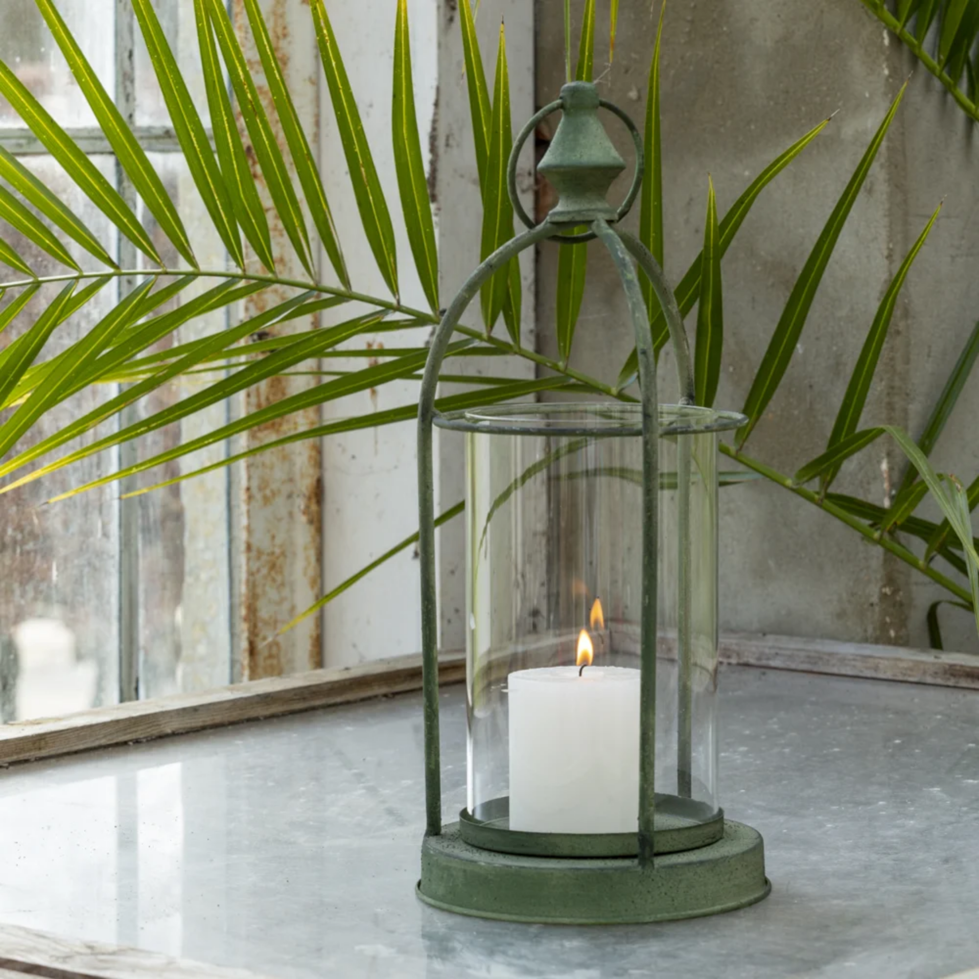 Vintage green metal hurricane lantern with glass cylinder will pillar candle