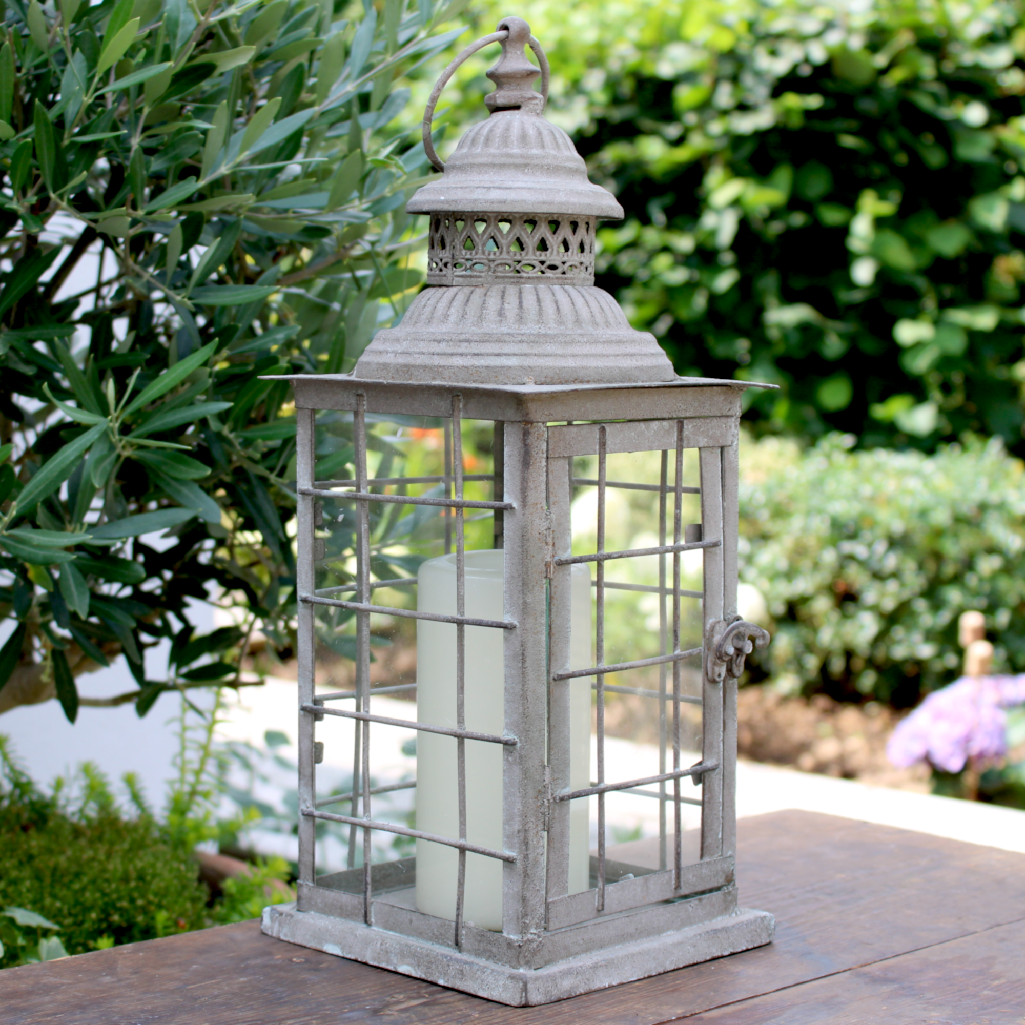 rustic metal candle lantern in the garden