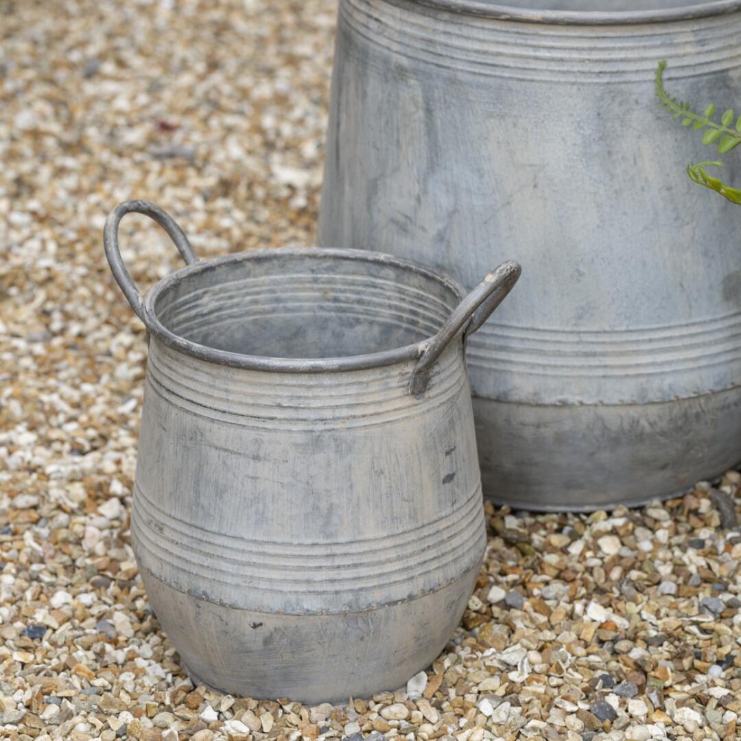 2 garden planters on gravel path