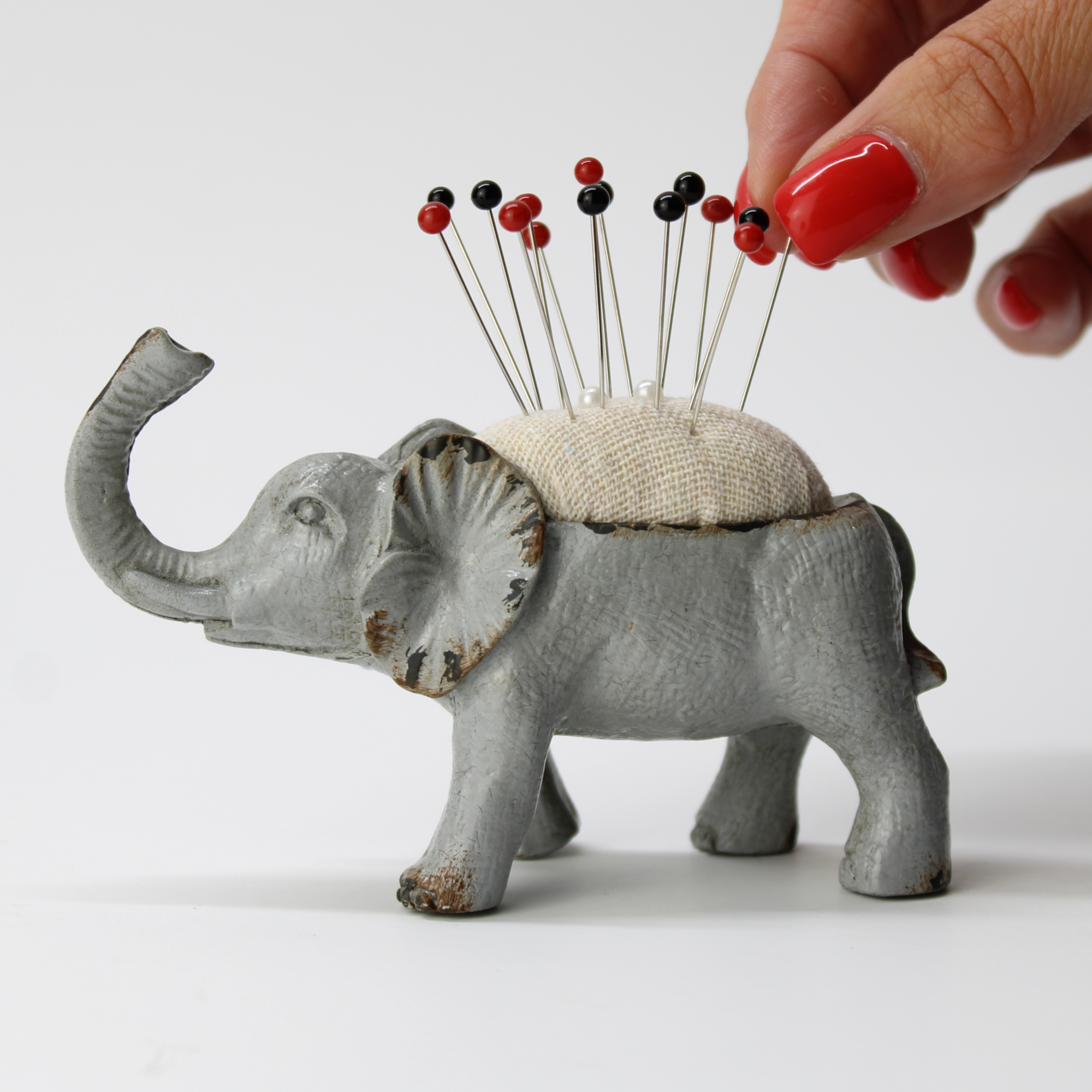Antique-style animal pin cushion for crafters and sewers