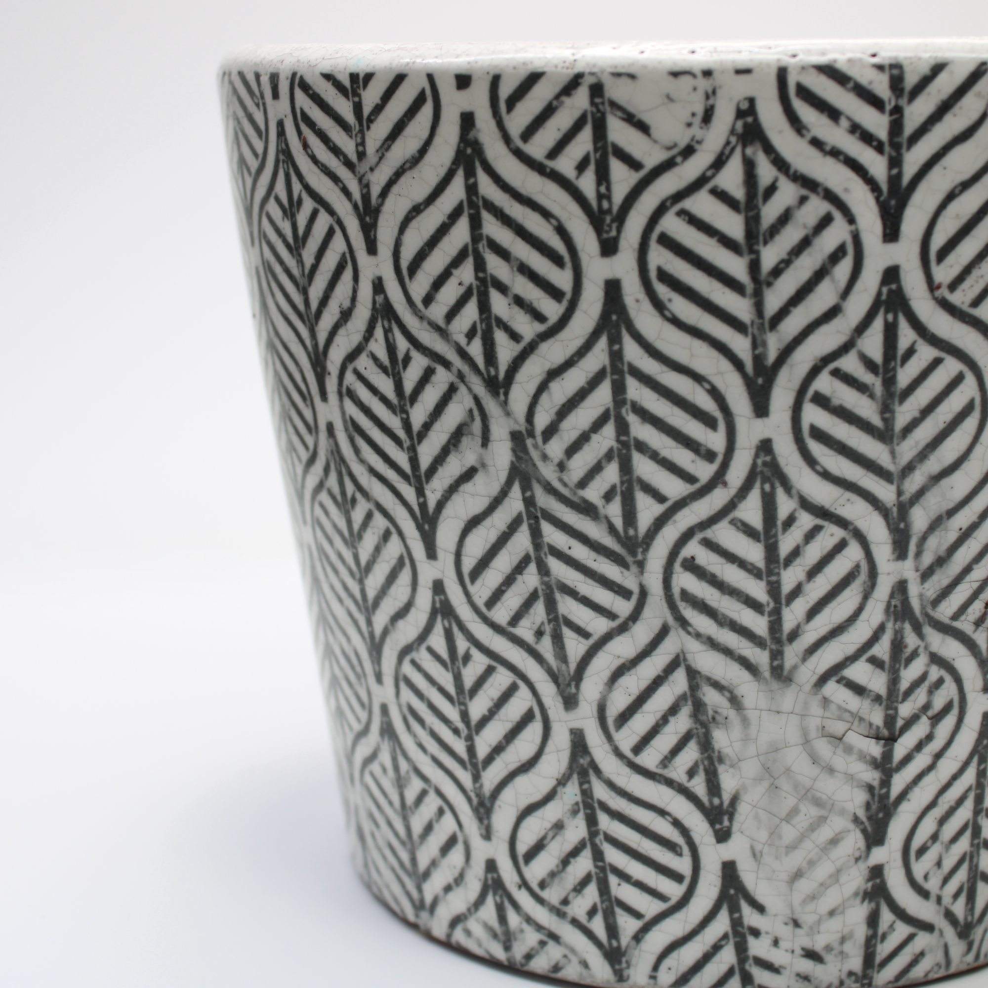closeup of rustic glazed pot focusing on the distressed finish