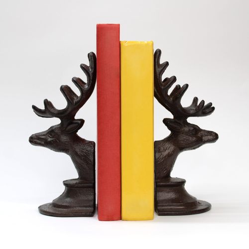 Cast iron stag head bookends with detailed antlers and a rustic finish.