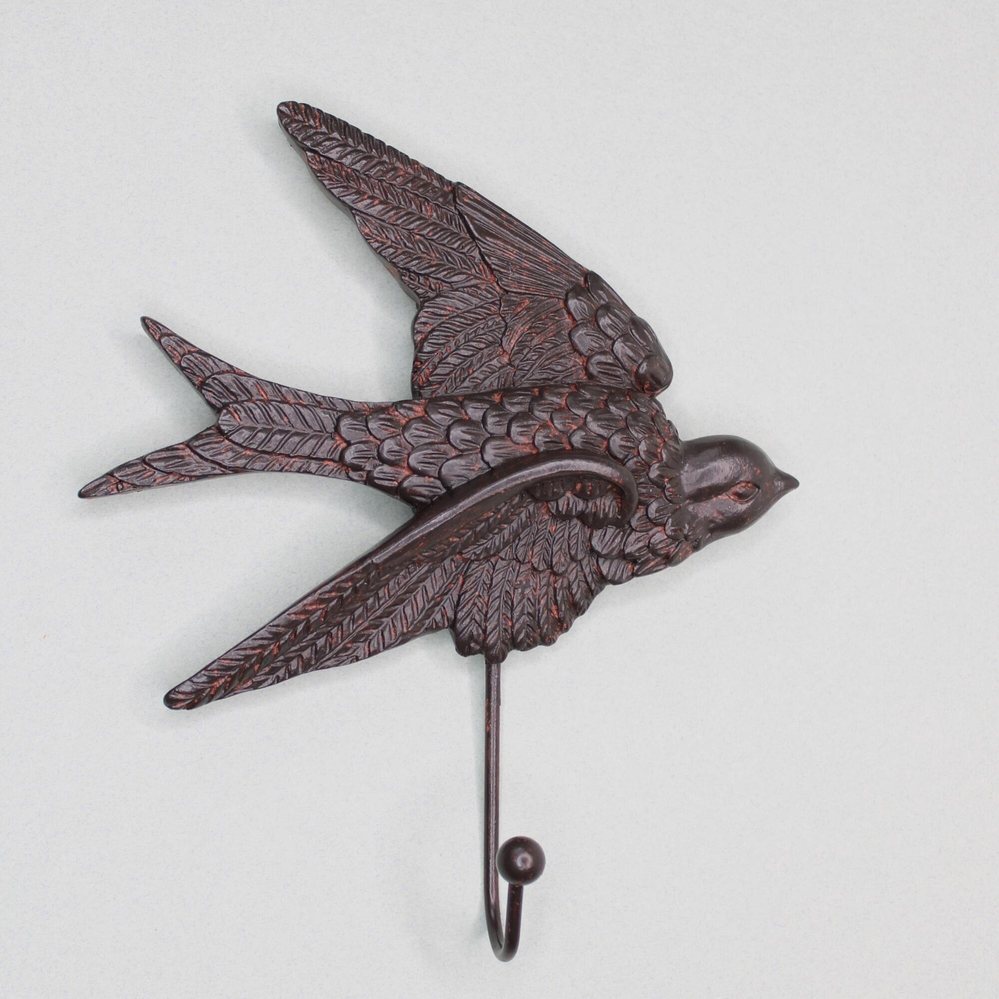 Nature-inspired bird wall hook for home decor, featuring a soaring swallow silhouette in a dark bronze tone.