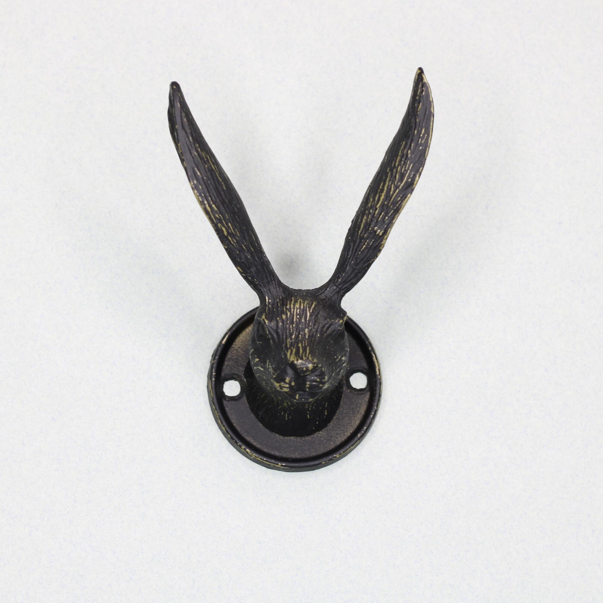 Front view of a black metal hare head hook showing dual mounting holes on circular base.
