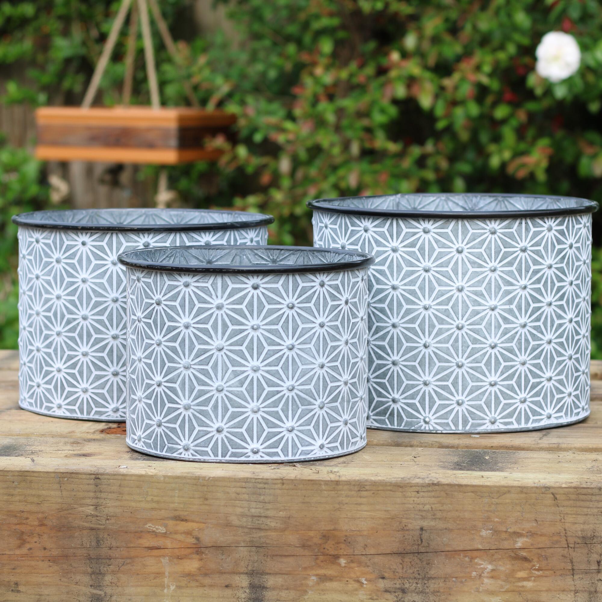 Set of 3 metal garden planters with a geometric embossed design