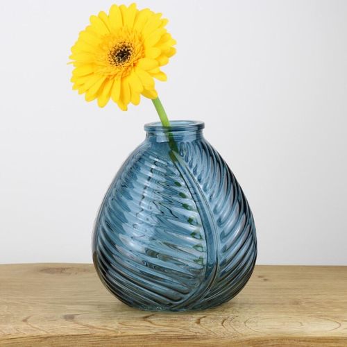 small blue bud vase with yellow flower