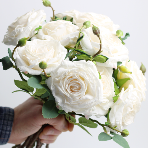 faux cream roses in a bouquet.