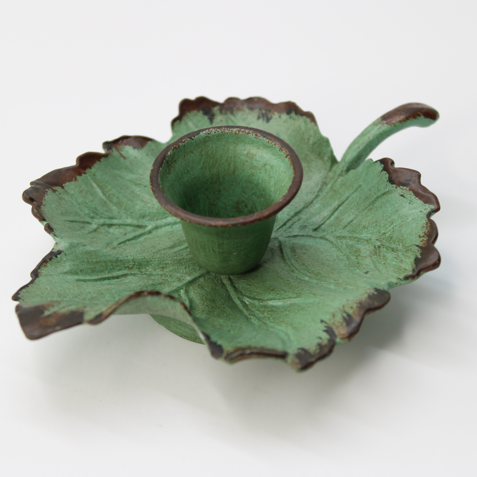 nature-themed cast iron chamberstick for vintage home decor
