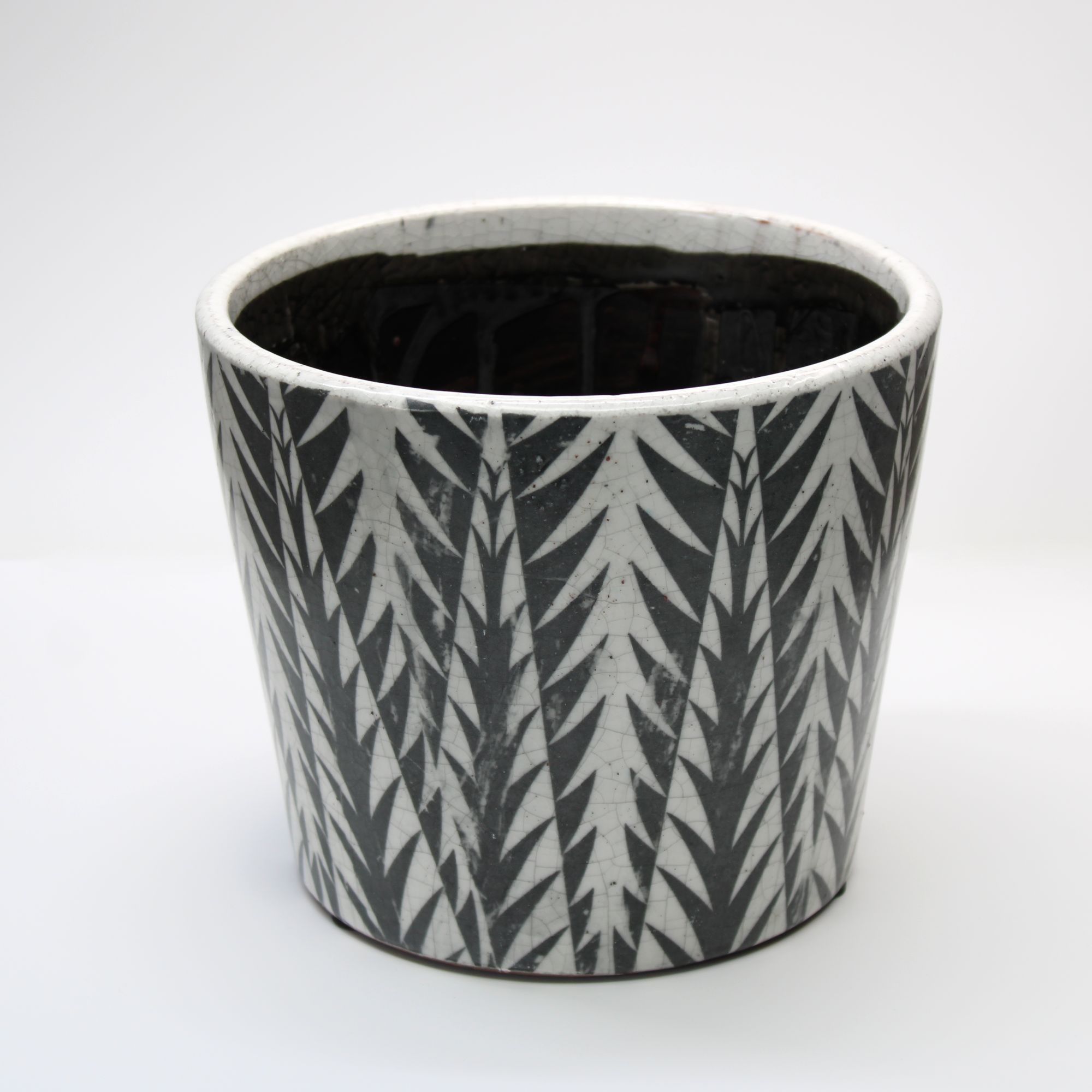 distressed glazed plant pot with black and white design
