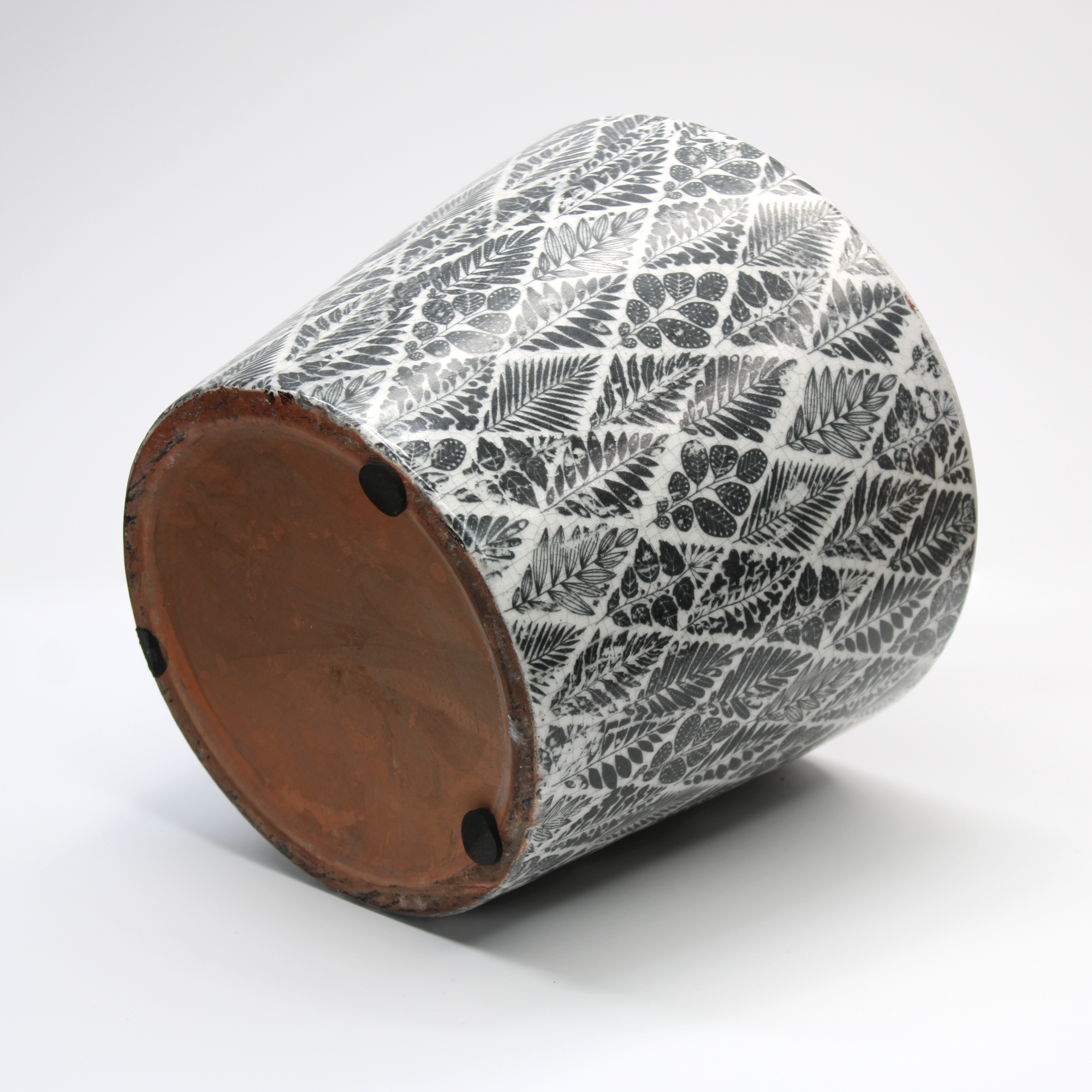 rustic plant pot with a distressed black and white glazed design