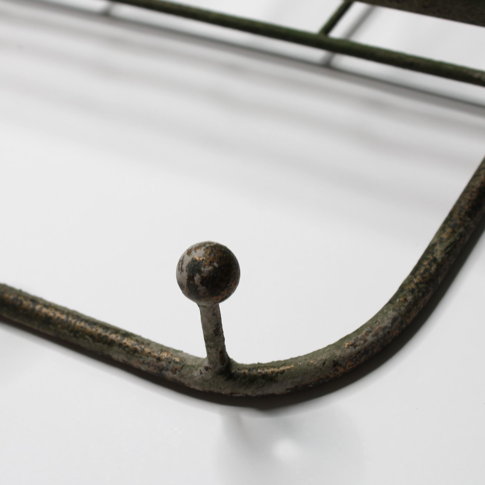 closeup of rustic coat rack focusing on the finish of the hook