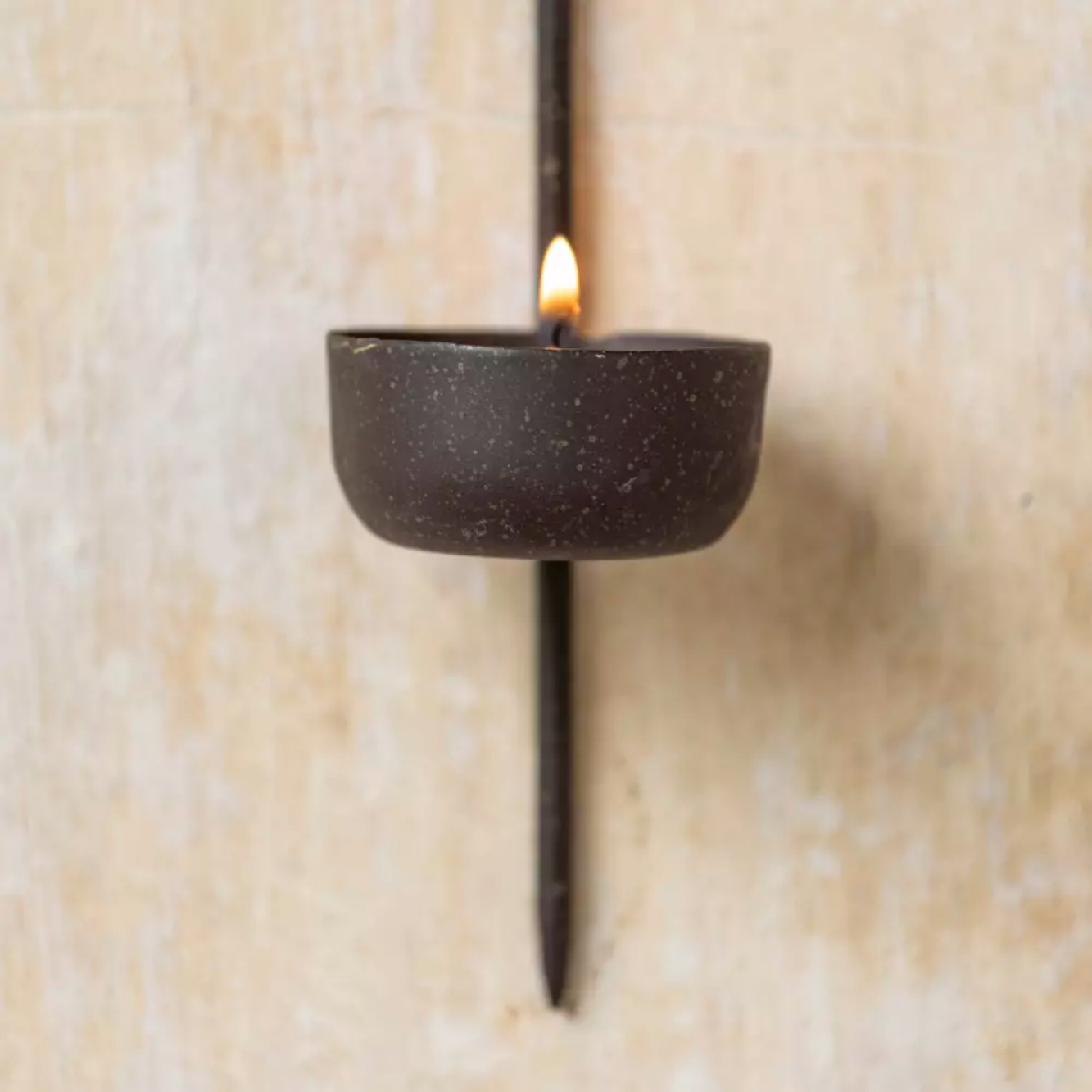 Closeup of Iron wall sconce tealight candle holder