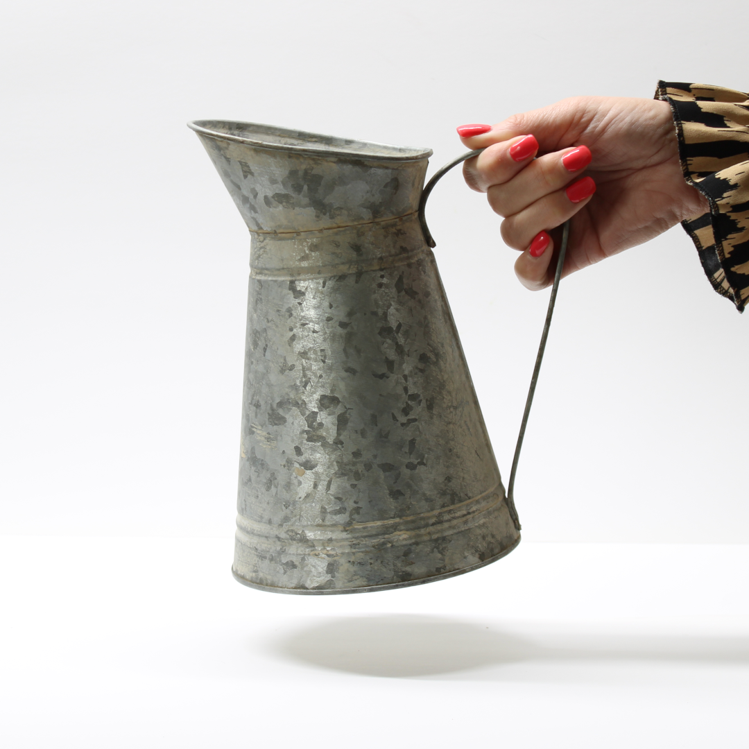 vintage style pitcher jug held via the handle