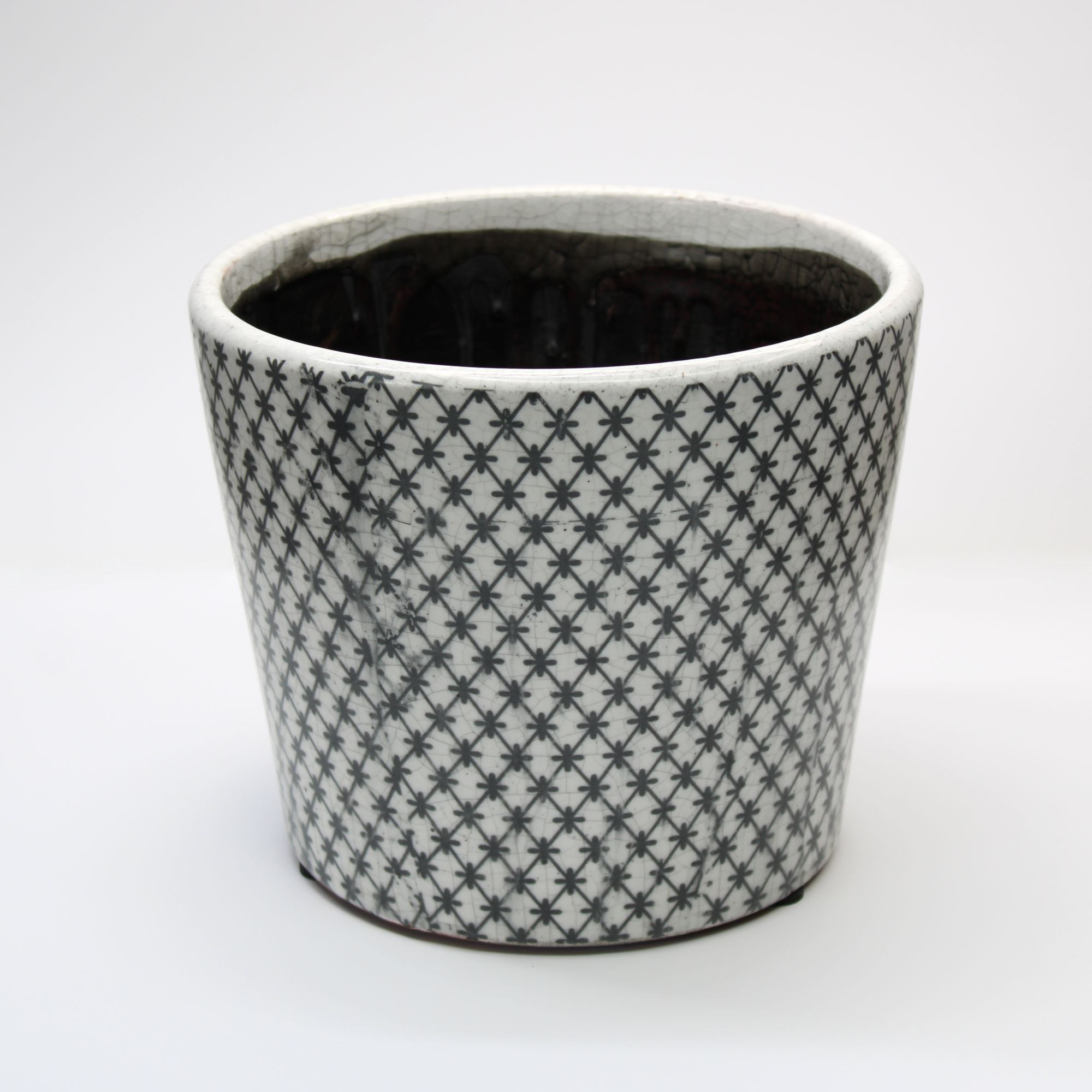 rustic plant pot with a black glaze inside the pot